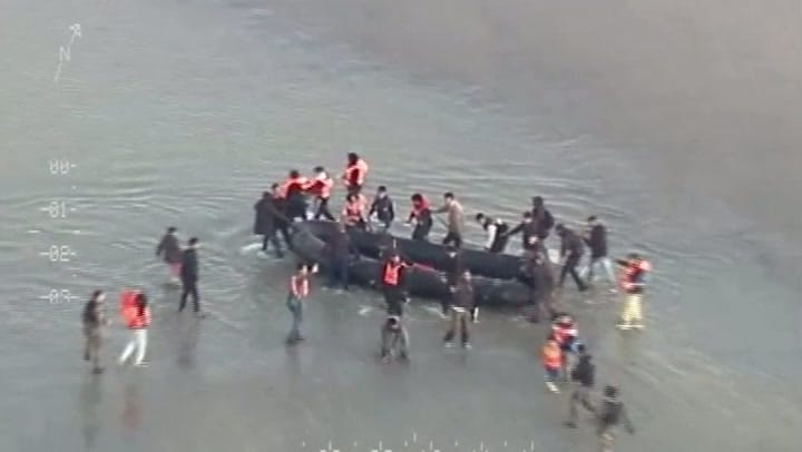 French police confront migrants attempting Channel crossing