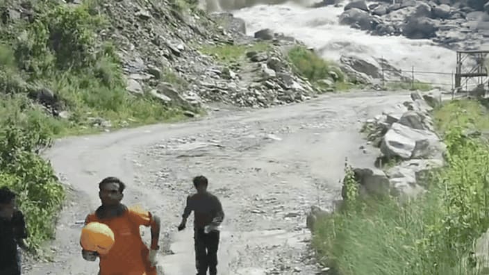 Flash Flood Destroys Bridge, Prompting Village Evacuation