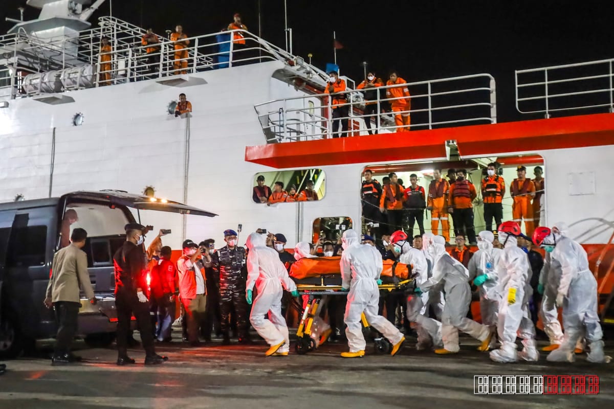 Rescue teams launch effort to right capsized Indonesian ferry amid rising death toll
